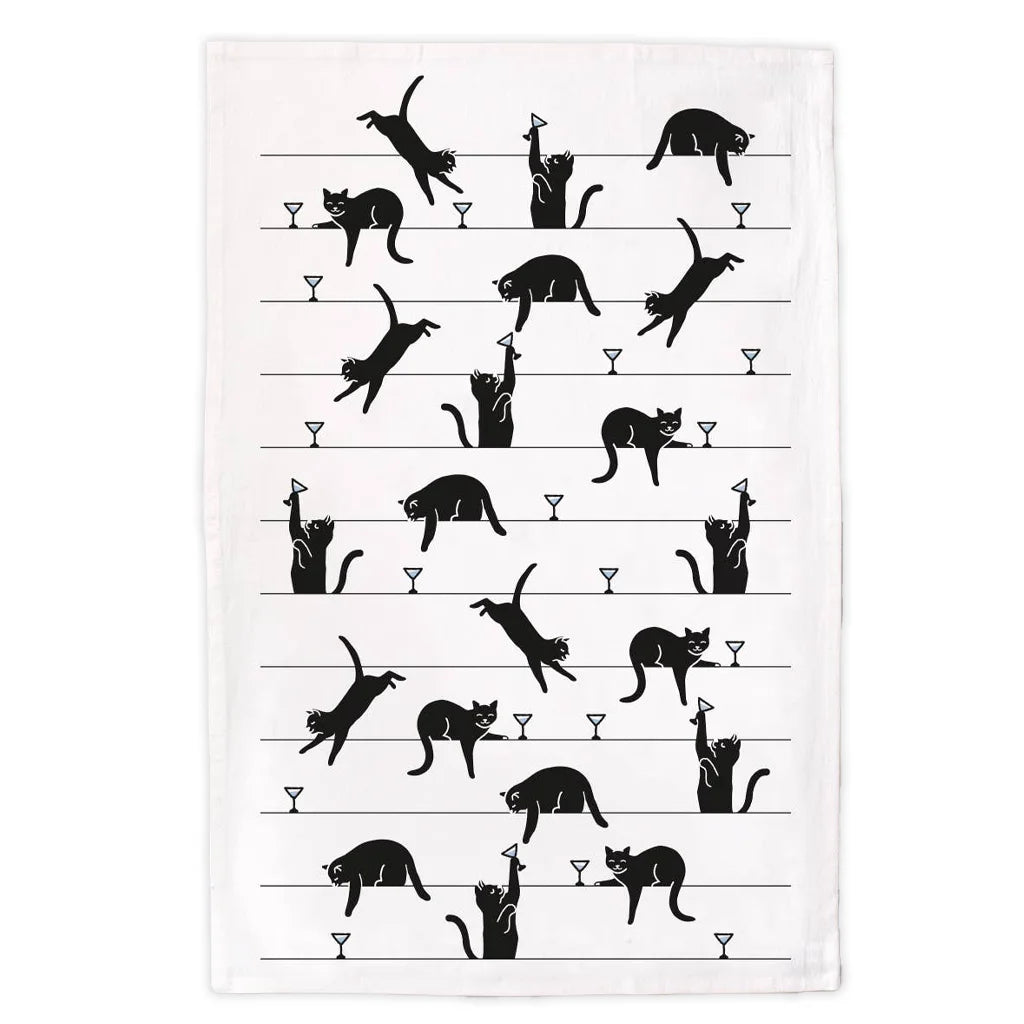 Tea towel with black cat and martini glass illustrations on a white background