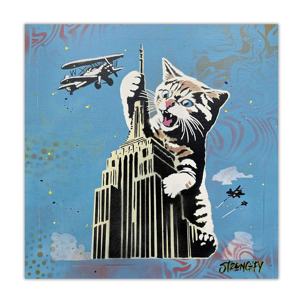 Cat climbing the Empire State Building with airplanes in the sky on a blue background